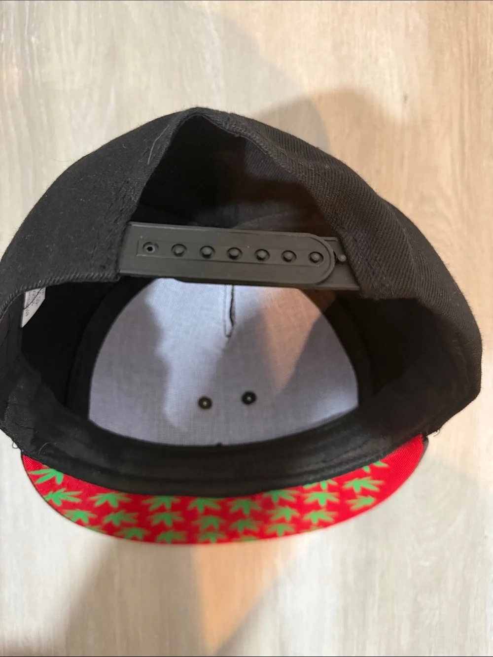 Black Men's Snapback Hat with Gold Leaf Embellishment